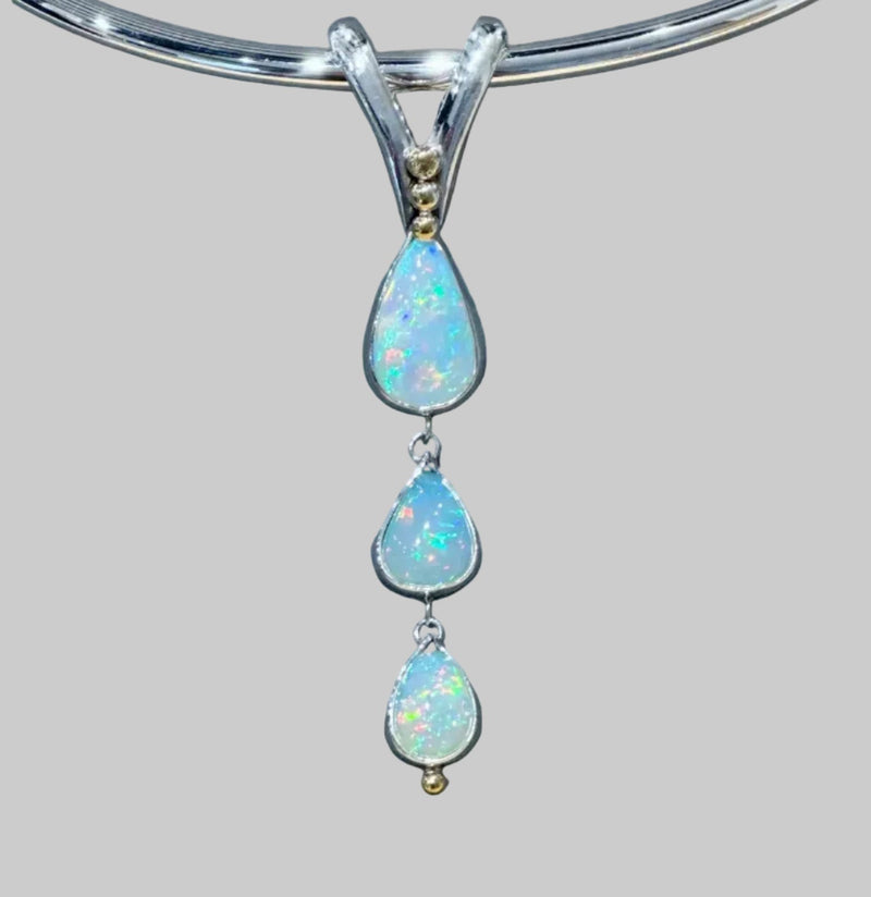 'Cheryl' a triple opal drop pendant and solid torc necklace in gold and silver